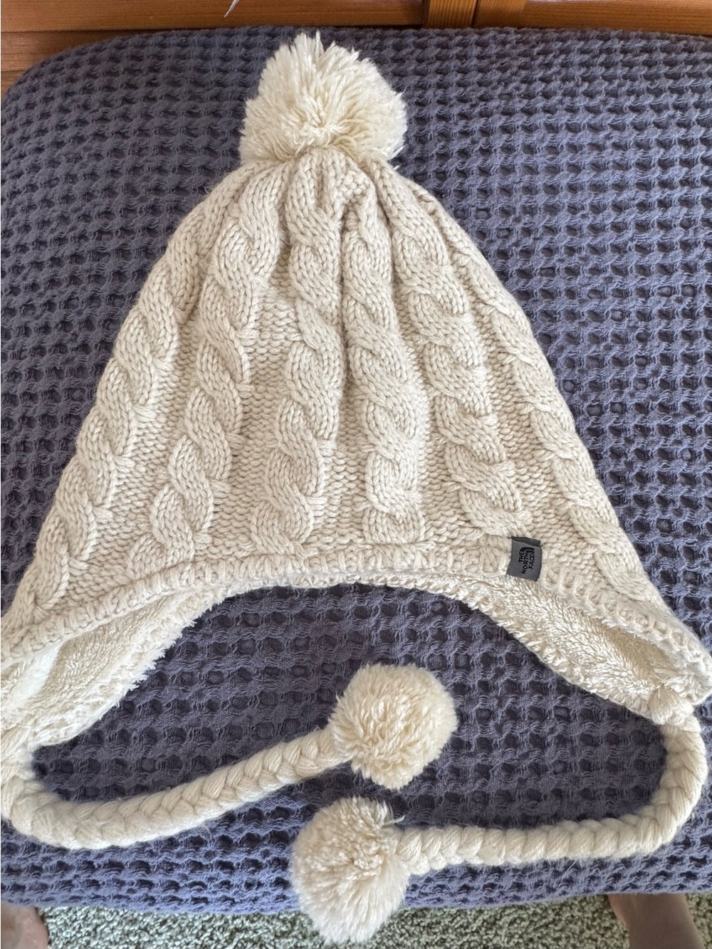 Nothface womens Cream Cable-Knit Earflap Hat with Pom Poms